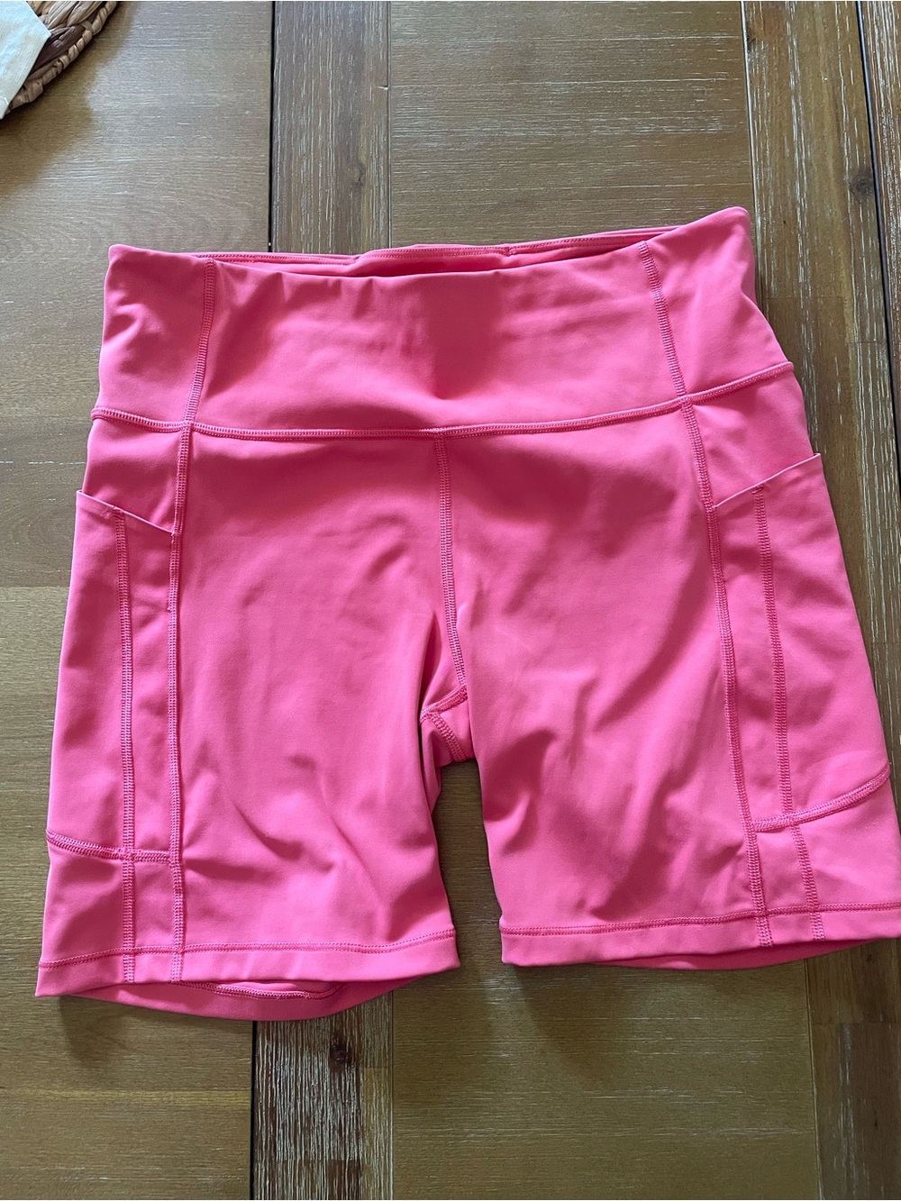 Athleta Coral Pink High-Rise Bike Shorts with Side Pockets